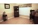 Bright home office features wood flooring and built-in shelving at 11021 Edge Park Dr, Hudson, FL 34667