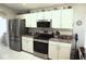 Modern kitchen with stainless steel appliances and granite countertops at 11021 Edge Park Dr, Hudson, FL 34667