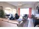 Bright living room features comfortable seating, large windows, and a spacious layout at 11021 Edge Park Dr, Hudson, FL 34667
