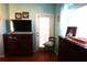 Main bedroom with wood floors and access to a private patio at 11021 Edge Park Dr, Hudson, FL 34667