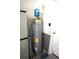 Mechanical room with water heater and storage at 11021 Edge Park Dr, Hudson, FL 34667