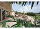 Outdoor patio with tables and umbrellas overlooking a golf course at 11021 Edge Park Dr, Hudson, FL 34667