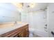Clean bathroom with a shower/tub combo and wood vanity at 11805 Northtrail Ave, Temple Terrace, FL 33617