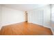 Well-lit bedroom with wood floors and a spacious closet at 11805 Northtrail Ave, Temple Terrace, FL 33617