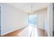 Bright dining room featuring hardwood floors and patio access at 11805 Northtrail Ave, Temple Terrace, FL 33617