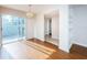 Sunlit dining room with hardwood floors and sliding glass doors at 11805 Northtrail Ave, Temple Terrace, FL 33617