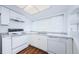 Updated kitchen with white cabinets and granite countertops at 11805 Northtrail Ave, Temple Terrace, FL 33617