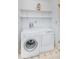 Laundry room with washer, dryer, and shelving at 11805 Northtrail Ave, Temple Terrace, FL 33617