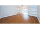Spacious living room featuring hardwood floors and access to kitchen at 11805 Northtrail Ave, Temple Terrace, FL 33617