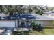 Single-story house, gray roof, and green lawn at 1206 Meadowcrest Dr, Valrico, FL 33594