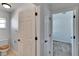 Bathroom with toilet and access to other rooms at 1206 Meadowcrest Dr, Valrico, FL 33594