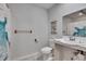 Bathroom with shower stall, toilet, sink, and decorative shower curtain at 1206 Meadowcrest Dr, Valrico, FL 33594