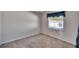 Simple bedroom with a window and neutral colored carpet at 1206 Meadowcrest Dr, Valrico, FL 33594