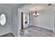 Dining room with chandelier and hardwood floors at 1206 Meadowcrest Dr, Valrico, FL 33594