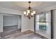 Dining room with chandelier and window view at 1206 Meadowcrest Dr, Valrico, FL 33594