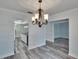 Dining room with chandelier and kitchen view at 1206 Meadowcrest Dr, Valrico, FL 33594