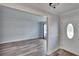 Entryway with hardwood floors and white walls at 1206 Meadowcrest Dr, Valrico, FL 33594