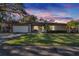 Single story home with a well-maintained lawn and attached garage at 1206 Meadowcrest Dr, Valrico, FL 33594