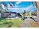 House exterior, green lawn, and street view at 1206 Meadowcrest Dr, Valrico, FL 33594