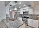 Modern kitchen with granite countertops and stainless steel appliances at 1206 Meadowcrest Dr, Valrico, FL 33594