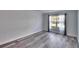 Living room with hardwood floors and large window at 1206 Meadowcrest Dr, Valrico, FL 33594