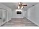Spacious living room with ceiling fan and vinyl flooring at 1206 Meadowcrest Dr, Valrico, FL 33594