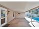 Covered patio overlooking the pool and backyard at 1206 Meadowcrest Dr, Valrico, FL 33594
