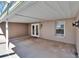 Covered patio with exterior access and pool view at 1206 Meadowcrest Dr, Valrico, FL 33594