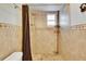 Clean shower with tiled walls and a shower curtain at 1206 Meadowcrest Dr, Valrico, FL 33594