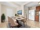 Dining area with a table for four and an open view to kitchen at 1310 Preston S St, St Petersburg, FL 33712