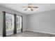 Living room with wood-look tile floors, ceiling fan, and gray walls at 13316 Wildgrass Trl, Odessa, FL 33556