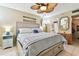 King-size bed, ceiling fan, and dresser in a bedroom at 14001 Gulf Blvd # 304, Madeira Beach, FL 33708