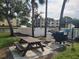 Community picnic area with BBQ grill and lake view at 14130 Rosemary Ln # 6214, Largo, FL 33774