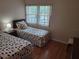 Bedroom with twin beds and polka dot bedding at 14130 Rosemary Ln # 6214, Largo, FL 33774