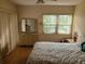 Bedroom with water view and floral bedding at 14130 Rosemary Ln # 6214, Largo, FL 33774
