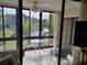 Enclosed patio with water view, table and chairs, great for relaxing at 14130 Rosemary Ln # 6214, Largo, FL 33774