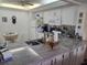 Kitchen with granite counters, breakfast nook, and appliances at 14130 Rosemary Ln # 6214, Largo, FL 33774