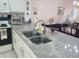Kitchen features granite countertops and a double sink at 14130 Rosemary Ln # 6214, Largo, FL 33774