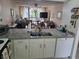 Kitchen with granite countertops, view of living room at 14130 Rosemary Ln # 6214, Largo, FL 33774