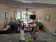 Living room with comfortable seating and access to balcony at 14130 Rosemary Ln # 6214, Largo, FL 33774