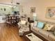Living room with comfortable seating and a view to the kitchen at 14130 Rosemary Ln # 6214, Largo, FL 33774