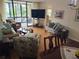 Open living and dining area with a view to the kitchen at 14130 Rosemary Ln # 6214, Largo, FL 33774