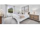 Main bedroom with large window and neutral color palette at 1500 Hammer Pl, Largo, FL 33774