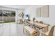 Modern dining area with sliding doors to the backyard at 1500 Hammer Pl, Largo, FL 33774