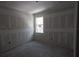 Unfinished bedroom with window and drywall at 15084 Mcgraw Ave, Port Charlotte, FL 33953