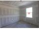 Unfinished bedroom with drywall and window at 15084 Mcgraw Ave, Port Charlotte, FL 33953