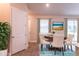 Bright dining room with round table and four chairs at 15084 Mcgraw Ave, Port Charlotte, FL 33953