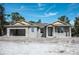 New construction home with gray siding and yellow accents at 15084 Mcgraw Ave, Port Charlotte, FL 33953