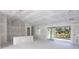 Open living area with drywall and sliding glass door at 15084 Mcgraw Ave, Port Charlotte, FL 33953