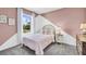 Charming bedroom with pink walls and unique decor at 1540 Hammer Pl, Largo, FL 33774